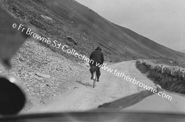 REV MC GRATH RIDING IN STORM. FROM MOTOR CAR